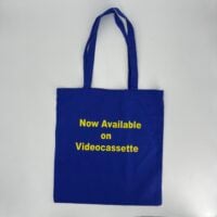 a cobalt blue bag with yellow text on it