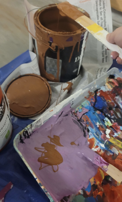 mixing purple and brown paint