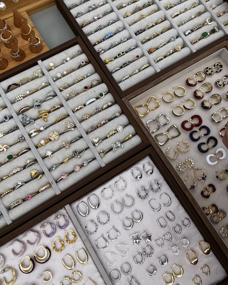 Many gold rings, silver rings, gold earrings, and silver earrings.