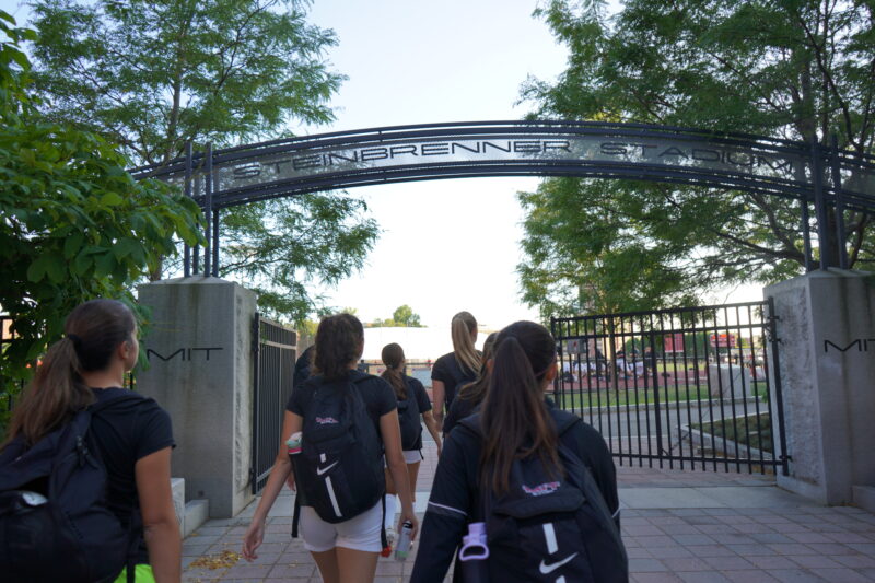 Soccer players entering stadium.