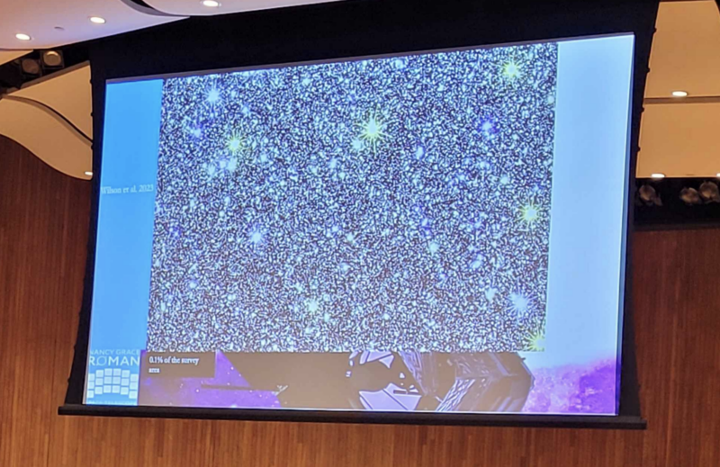 A presentation slide with a high-resolution picture of the night sky. Lots of stars are visible