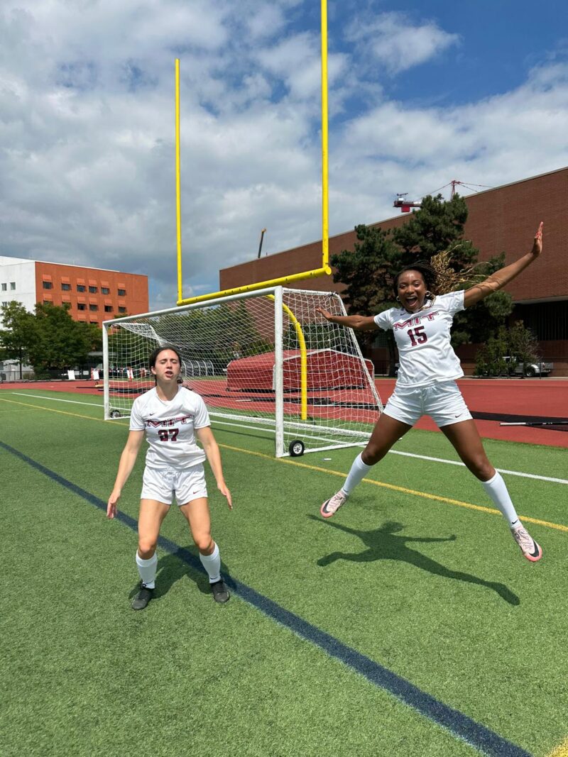 Two soccer players jumping.