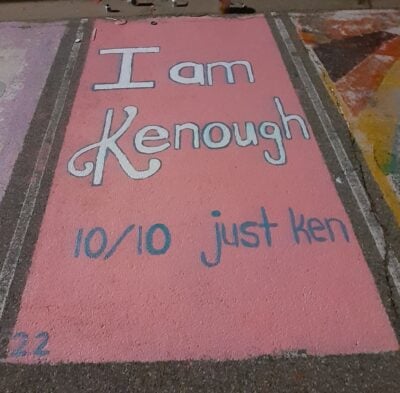 A screenshot of a parking spot reading "I am Kenough"