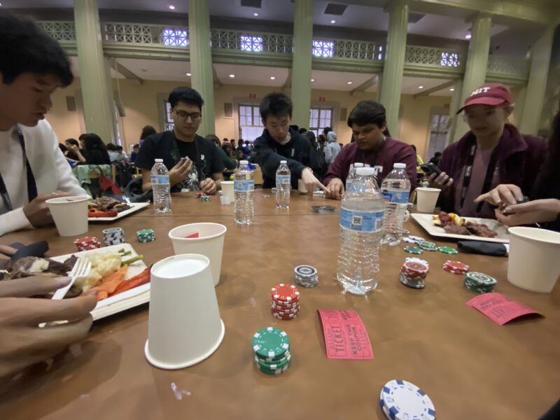 Photo of table with students playing poker