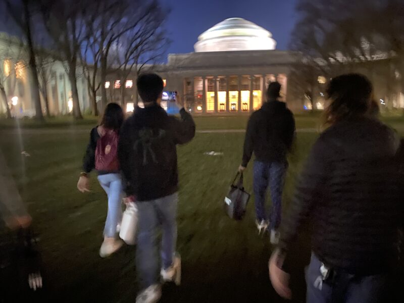 Image of students walking on the courtyard in front of MIT's Great Dome