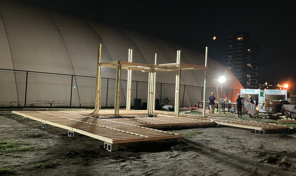 The built footprint of the fort with posts for the first three cube-shaped units in place.