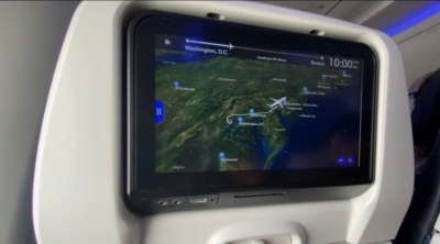 View of airplane seat screen showing flight path DC to Boston