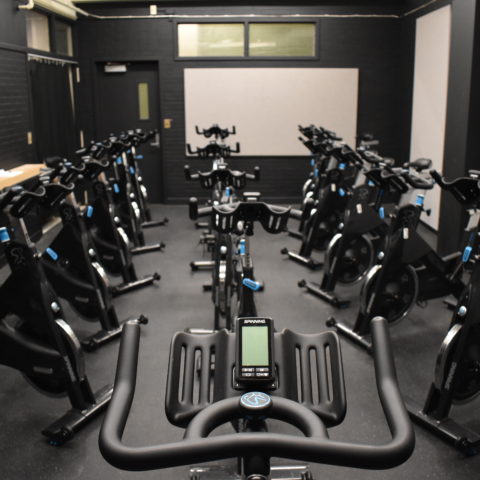 a picture of a small dark room filled with bikes