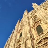 The Duomo in Milan, a tall cathedral with very detailed, sculpted features