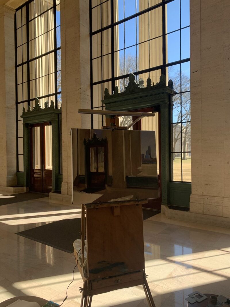 the floor to ceiling windows in Lobby 10, with a painting of them in front of them.