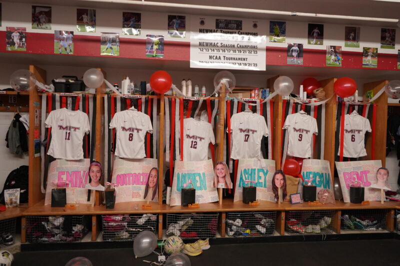 Locker decorated with posters and signs.