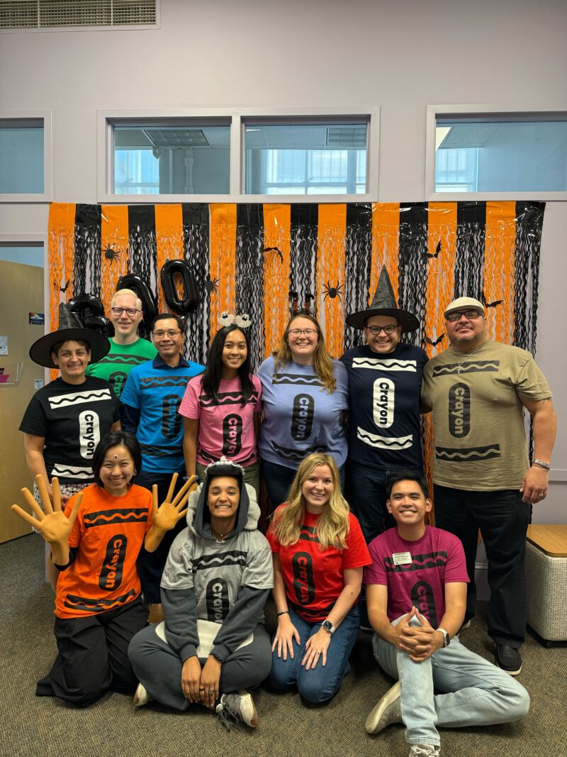 photo of about ten people dressed up in crayon shirts. very cool