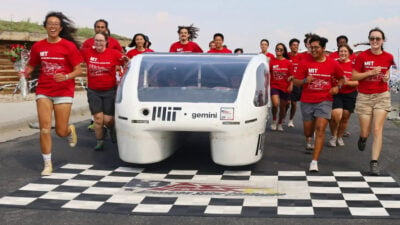 The MIT Solar Electric Vehicle Team crosses the finish line with their vehicle, Gemini, at ASC 2024.