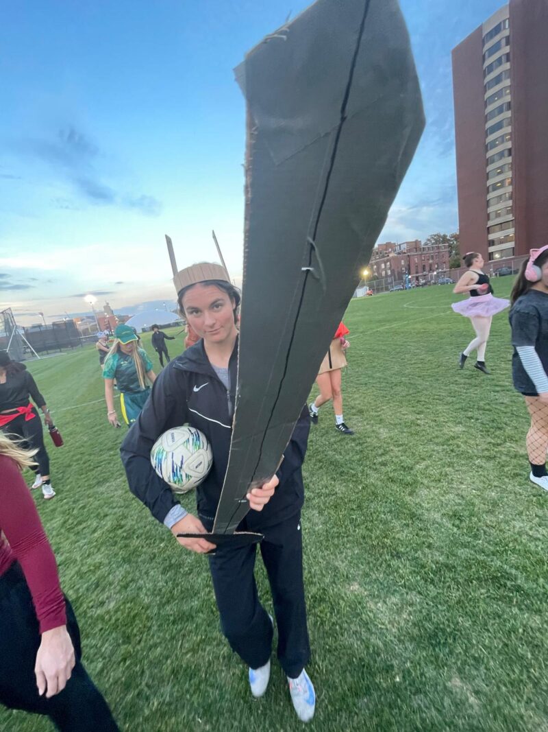 Player dressed up as a sword fighter with a huge sword.