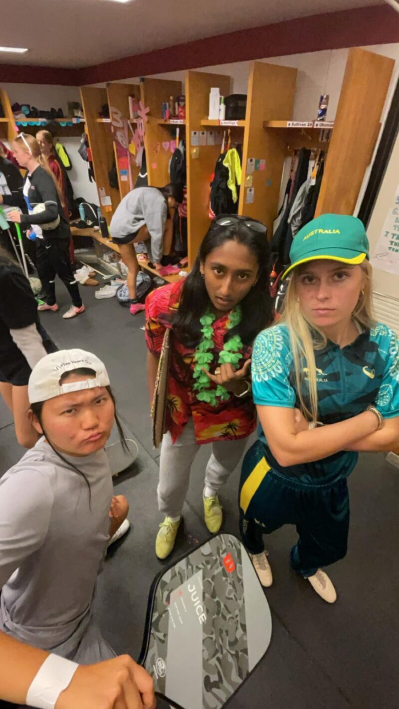 Three girls dressed up a surfers and breakdancers.