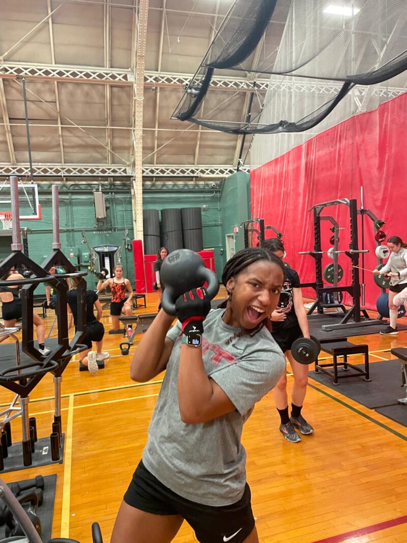 Player lifting weight and screaming.