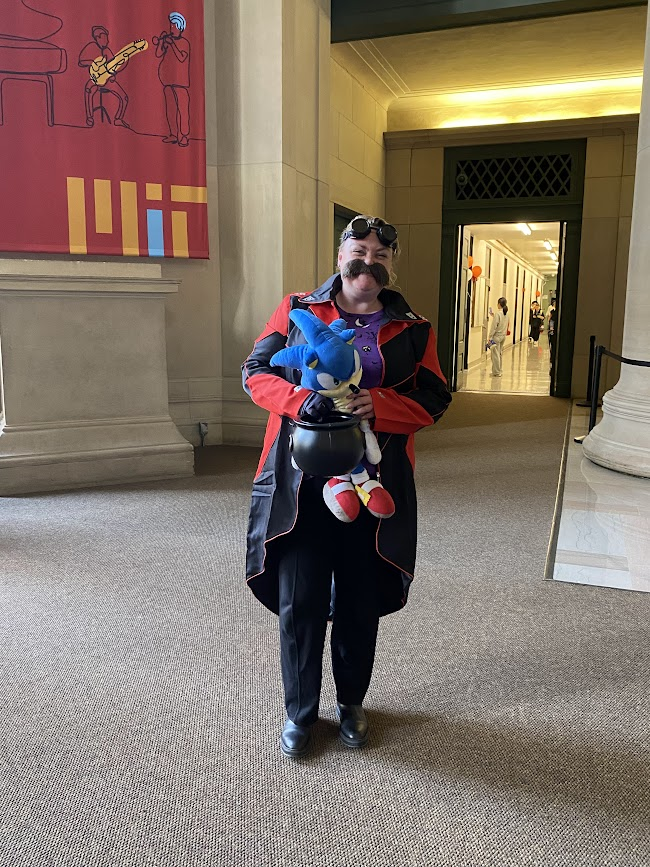 person dressed up in sonic gear holding candy