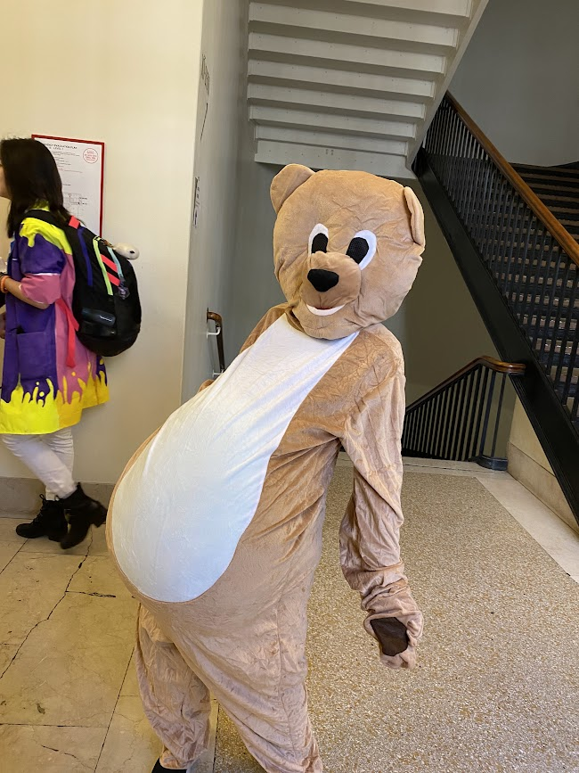 someone in a pregnant bear costume