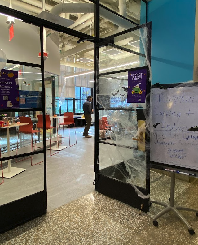 photo of open glass door with halloween deco
