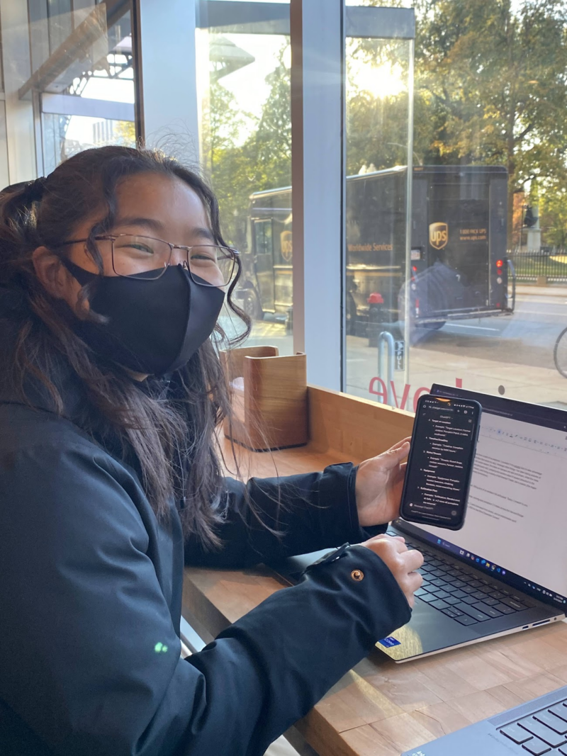 person holding up a phone with chatgpt