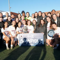 Team celebrating with trophy.