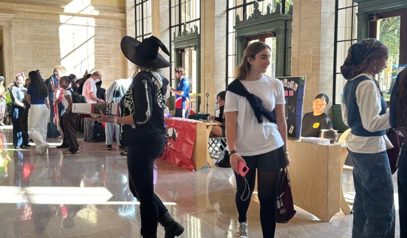 Photo of tables set up giving out candy in the infinite during Halloween.
