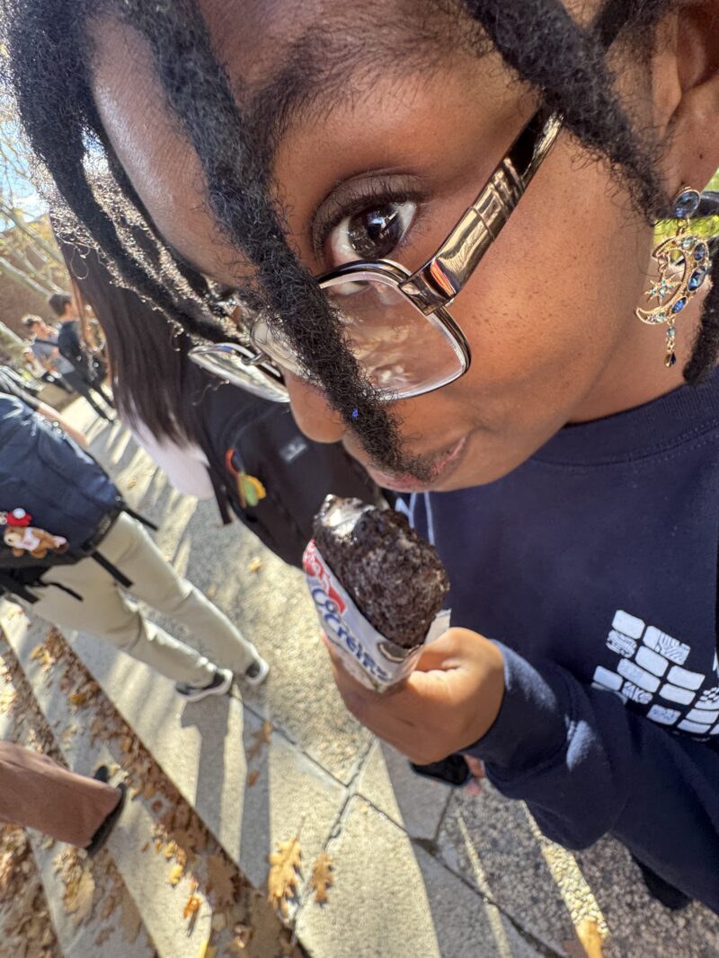 Closeup picture of girl eating ice cream from above.
