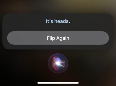 A screenshot of siri saying "It's heads" 