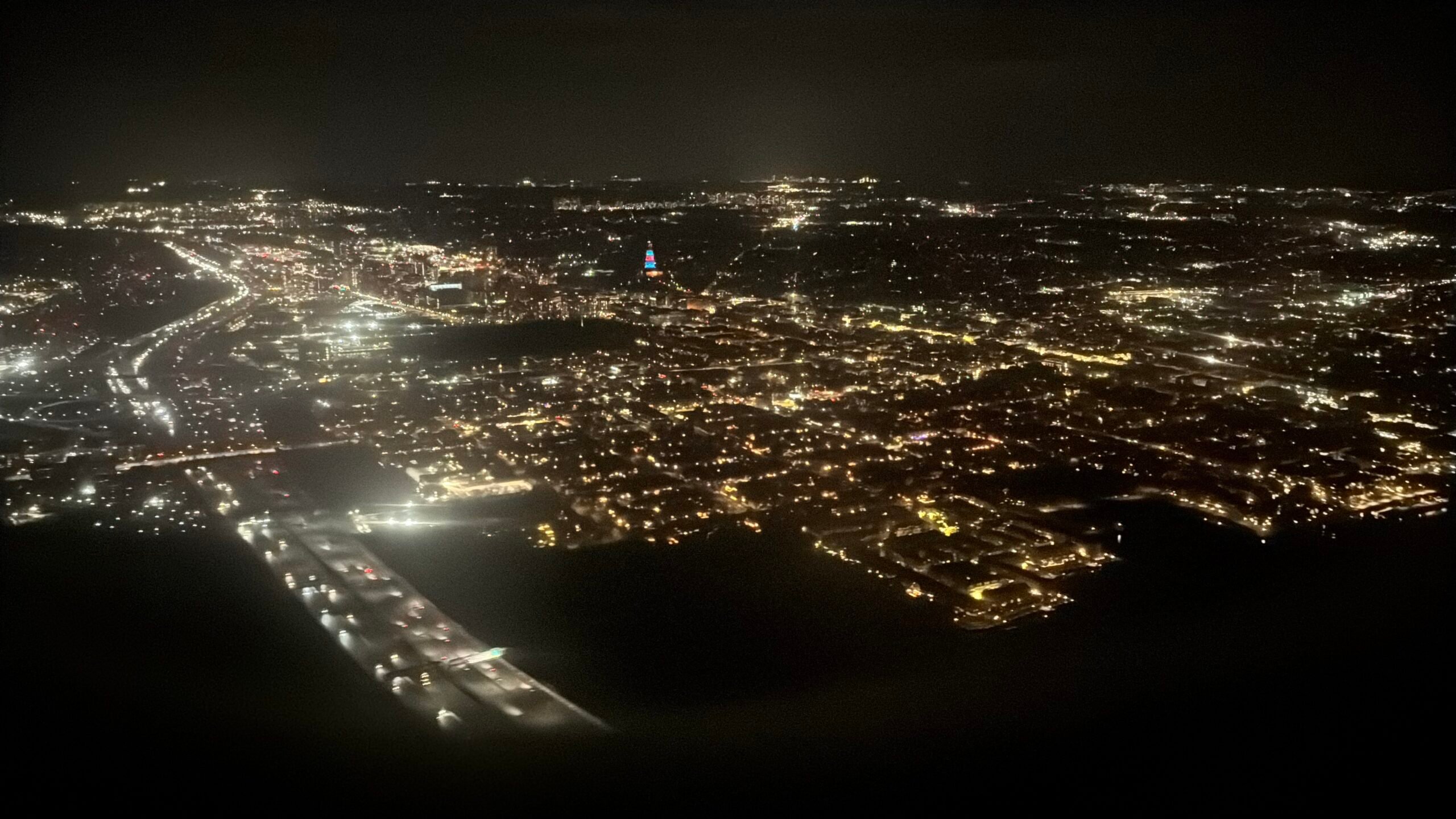 Night photo of the national harbor from airplane window