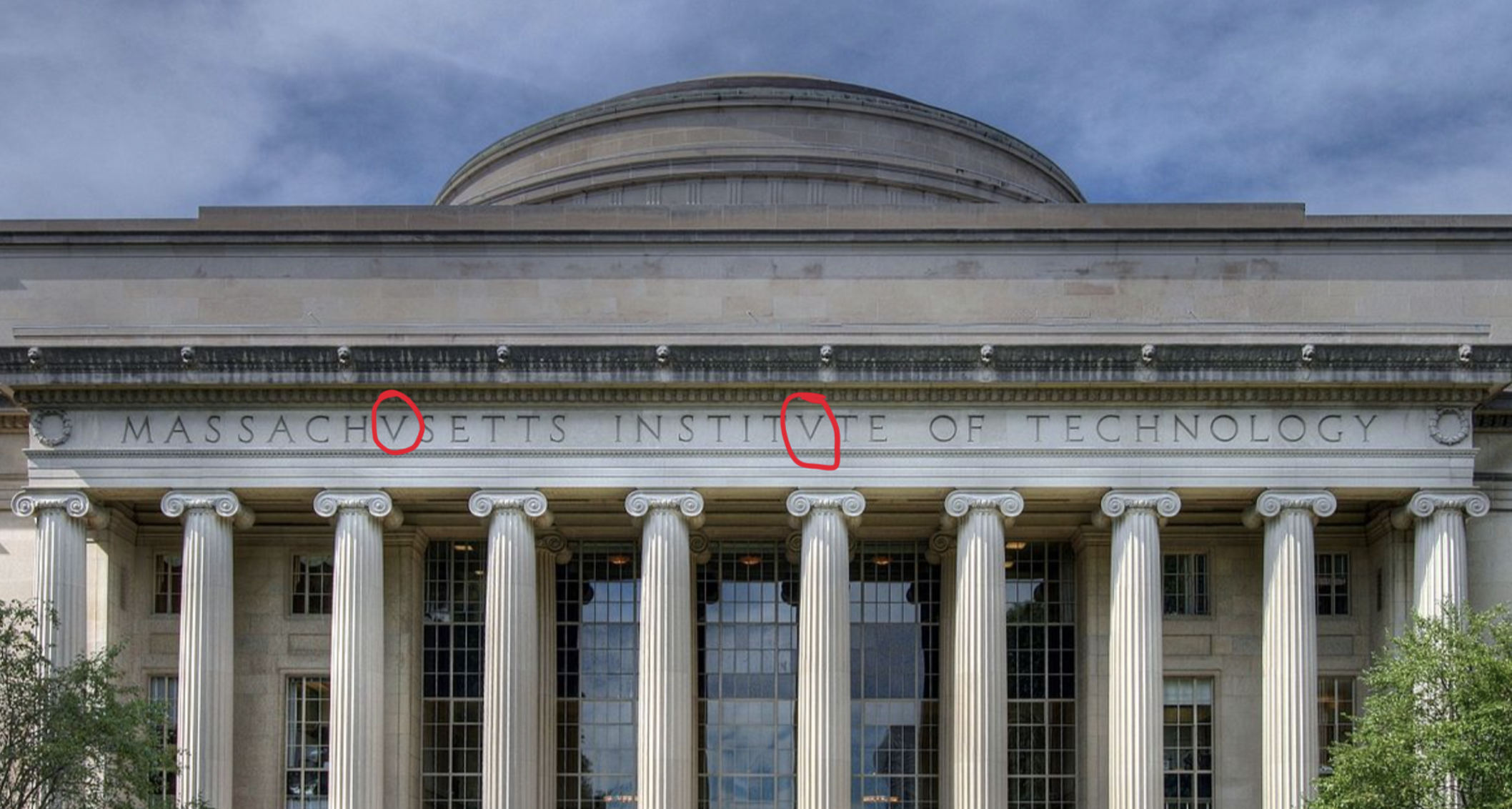 Photo of the MIT Dome highlighting the V's used instead of U's in the building lettering