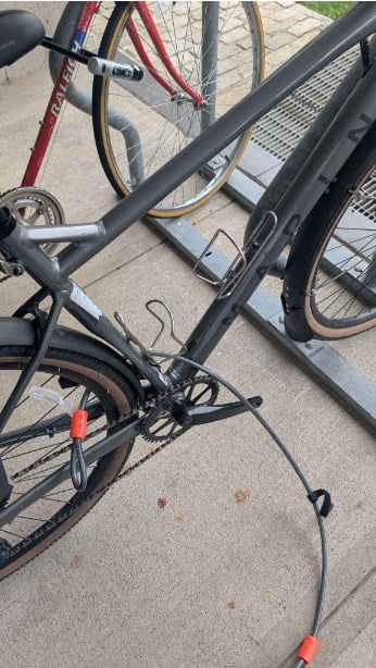 Photo of a bicycle with the pedals removed.