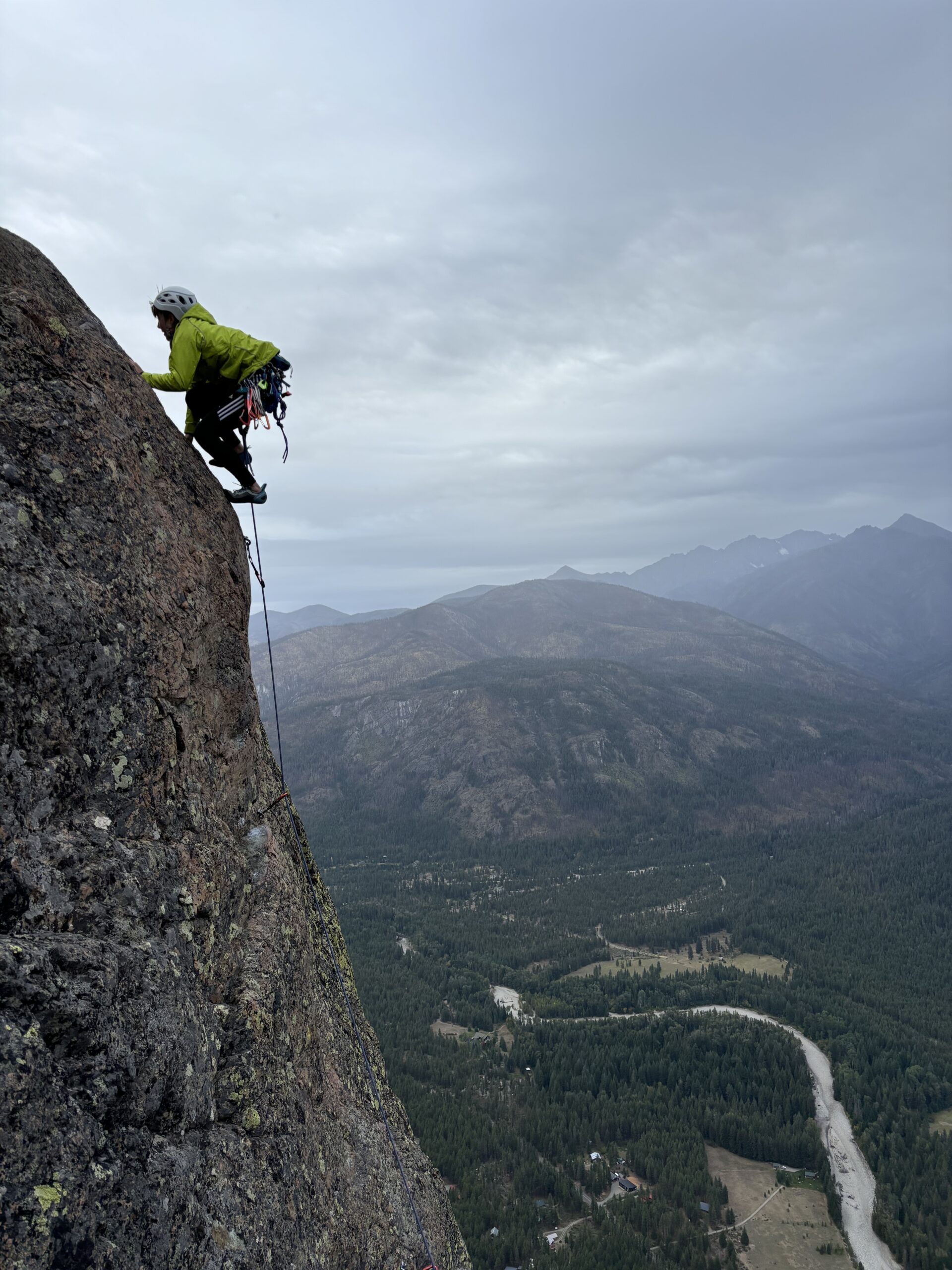 person climbing a rock face