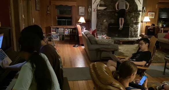 people sitting around in a cabin