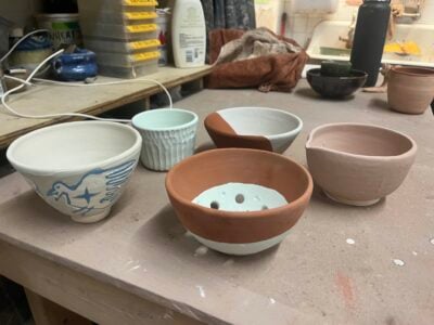 a picture of 5 glazed pottery vessels