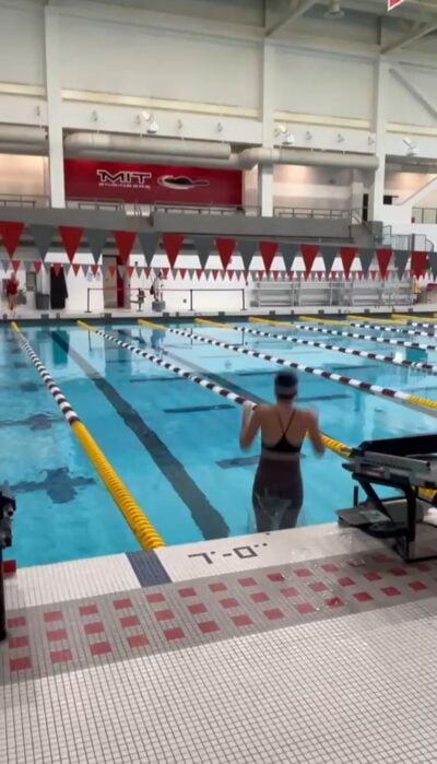 Person jumping into pool.