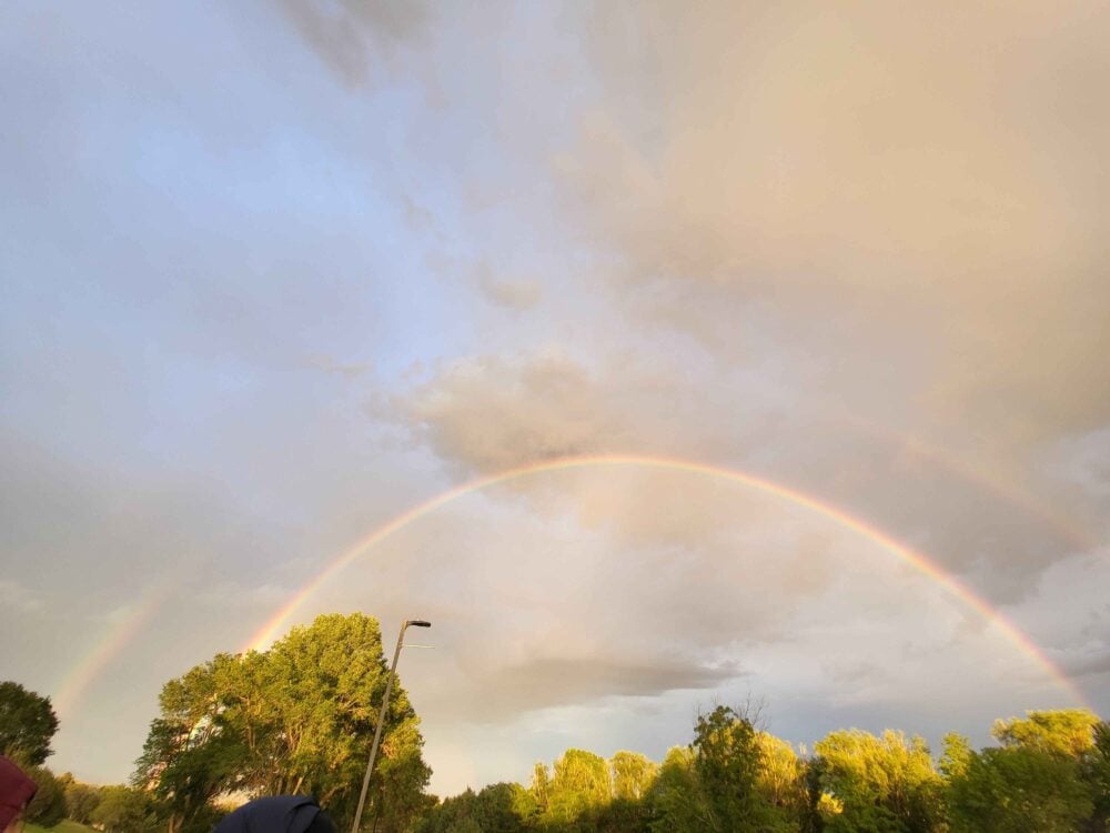 double rainbow over a sunset