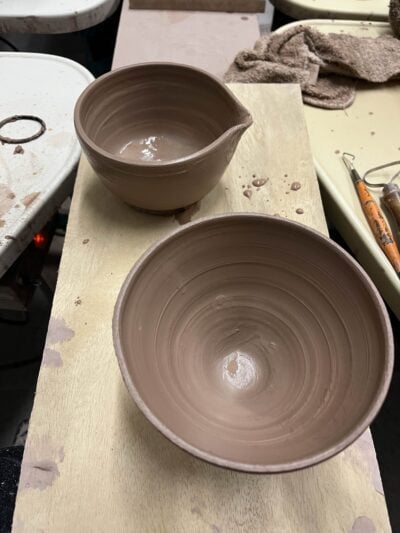 a picture of a bat with two clay bowls on it