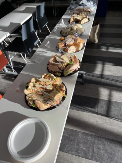 a picture of a table with many sandwiches on it