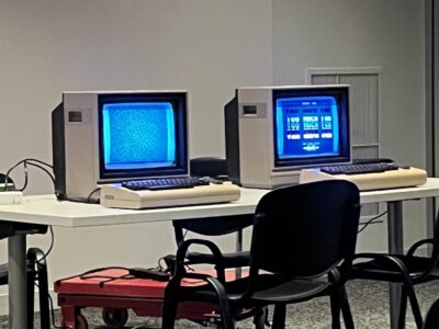 a grainy picture of two Commodore 64 computers