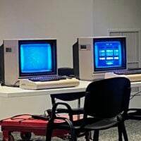 a grainy picture of two Commodore 64 computers