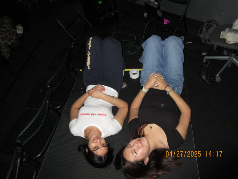 two girls lying down looking up