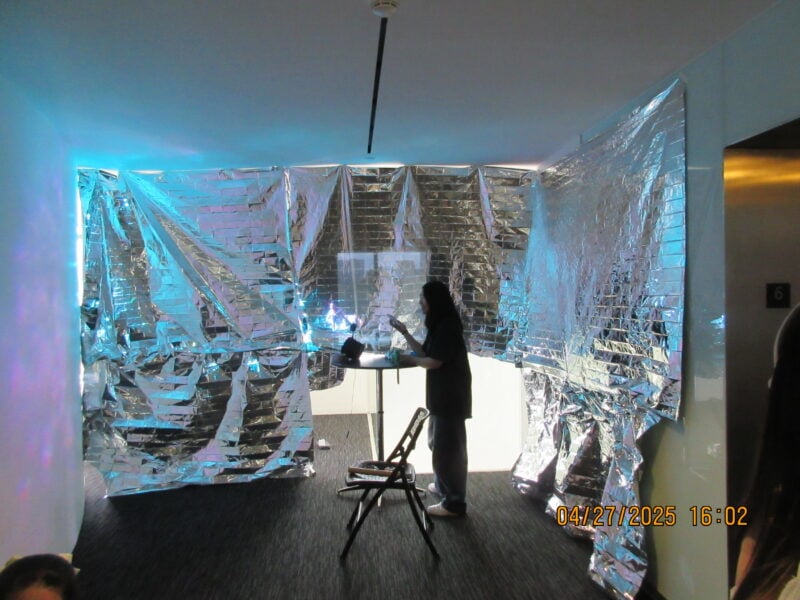 mylar sheets pinned to the walls