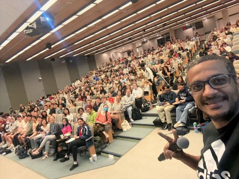 Selfie of Professor Mohamed Abdelhafez in a full 26-100 lecture hall during his final 8.02 review session