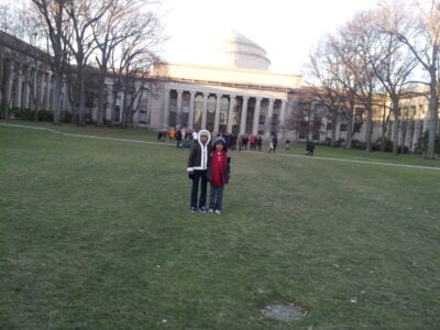 Me and Raiye standing on a notably snow-less Killian Court in front of the dome. All of the grass on the Court is visible.