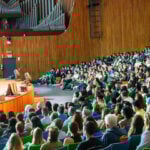Students at a Delta V presentation in an auditorium.