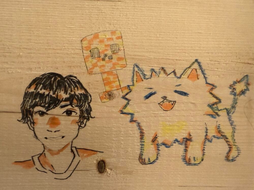 drawing on wood featuring a person, creeper, and a spiky 4 legged animal