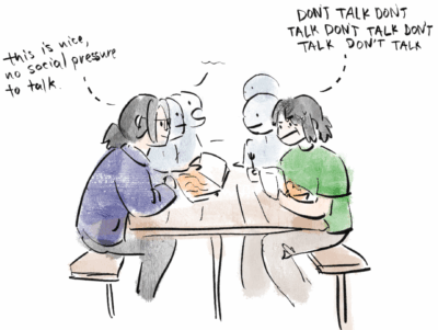 eating food at table and i was trying very hard not to 