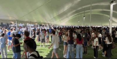 Crowd of kids in Kresge Oval playing the card game.