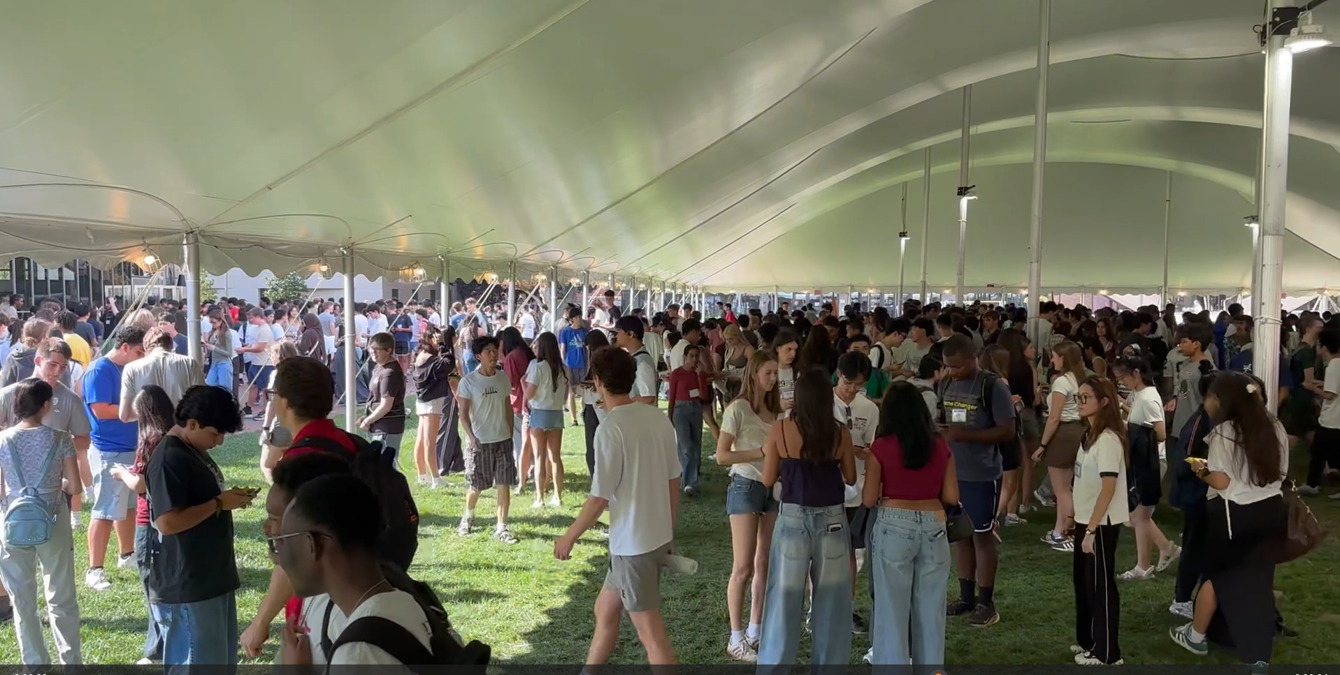 Crowd of kids in Kresge Oval playing the card game.