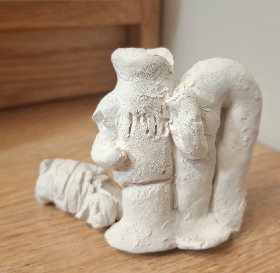 Long tim in clay with head fallen off